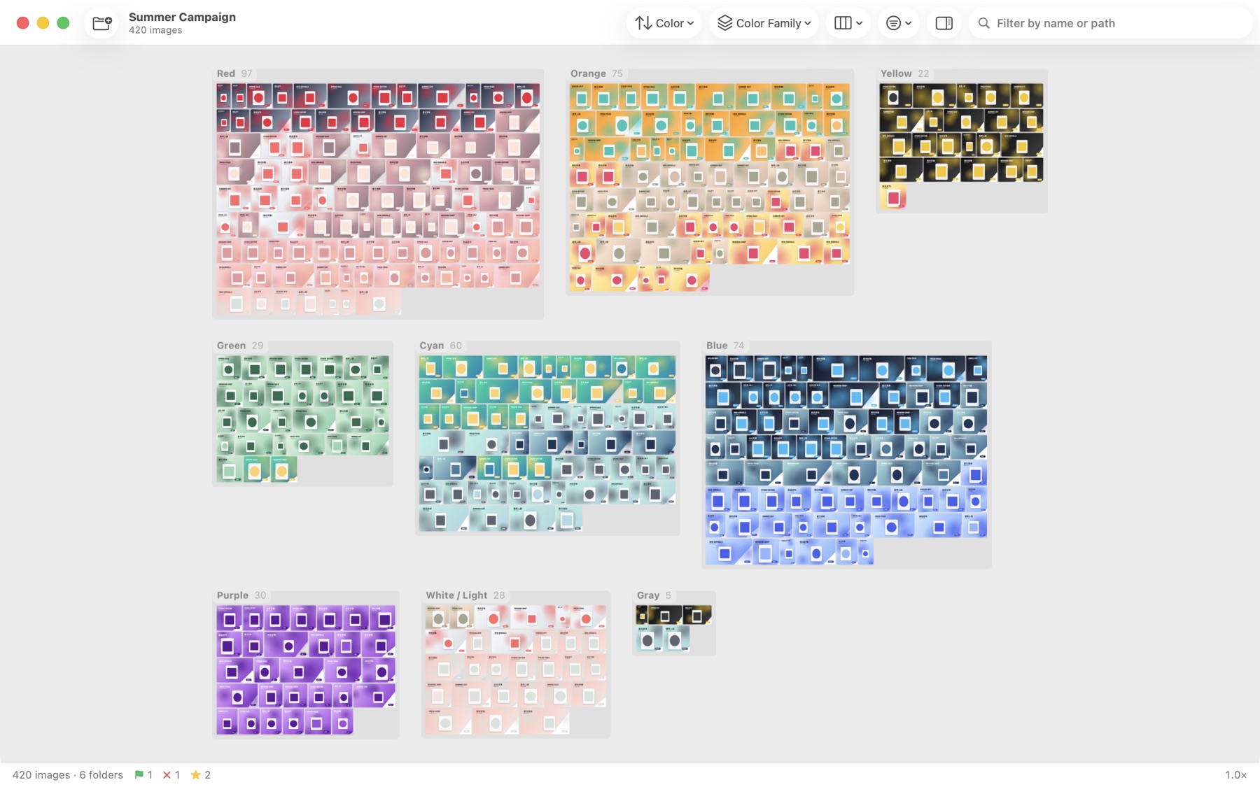 Hundreds of campaign images grouped by color family on the Zoomosaic canvas